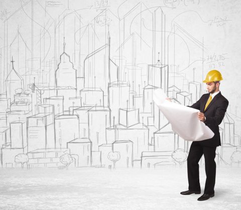 Construction worker with cityscape background